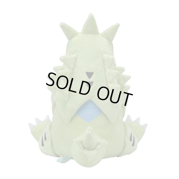 tyranitar holding larvitar plush